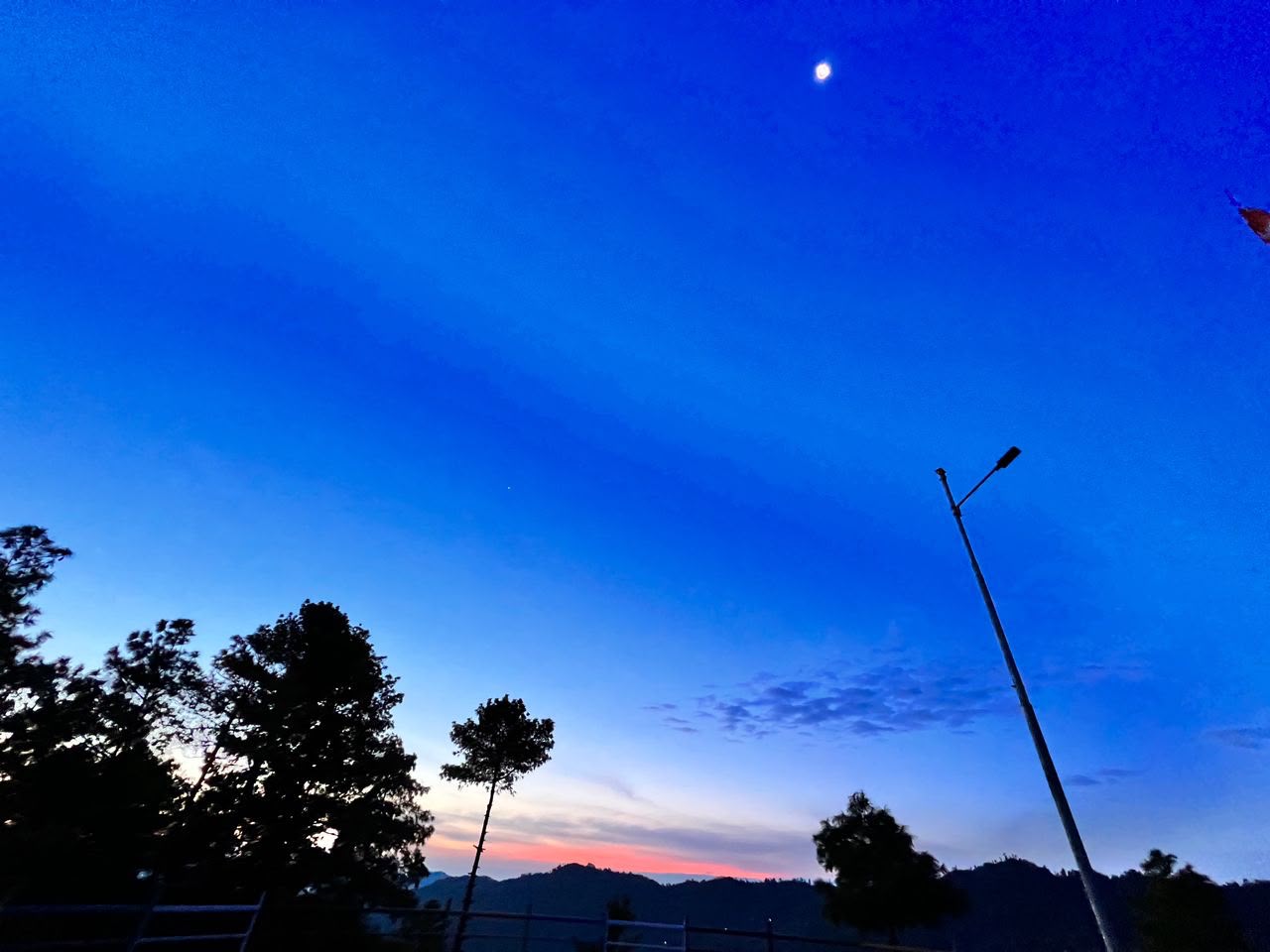 Moon and sun in the same sky near Hotel Paradise Daman