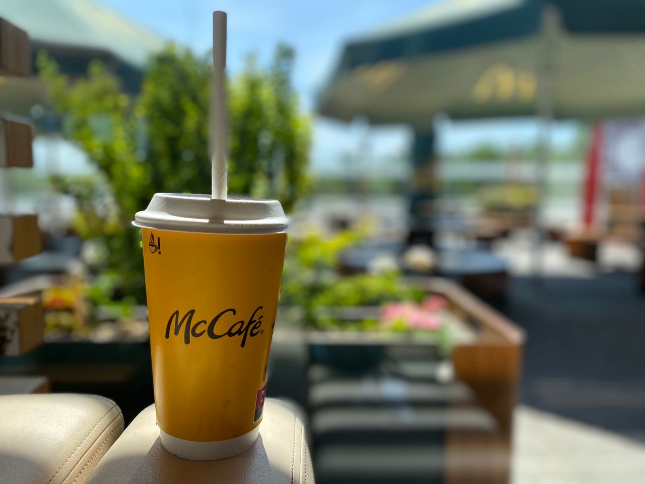 McCafé paper cup with paper lid and paper straw in Poland