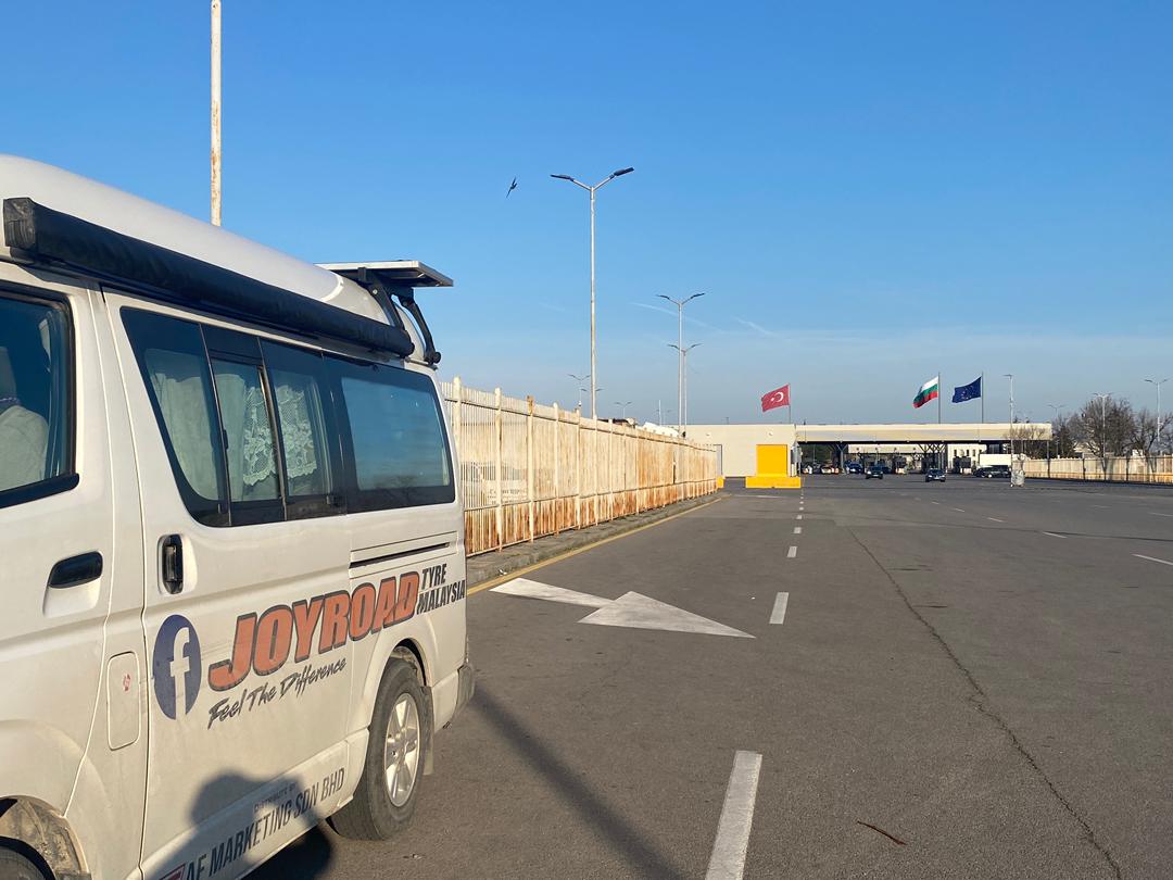 Toyotaki at Kapitan Andreevo Bulgaria border with Turkey, Bulgaria and EU flags ahead
