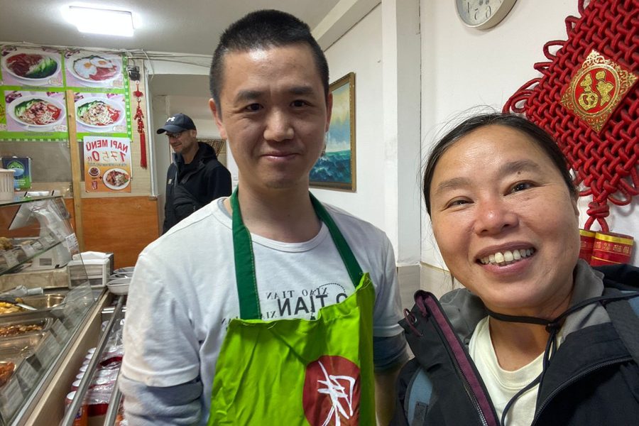 Tuzi with the Chinese buffet owner in Budapest Hungary