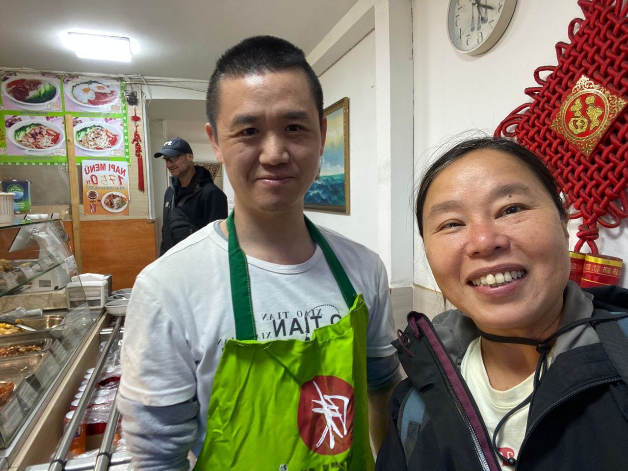 Tuzi with the Chinese buffet owner in Budapest Hungary
