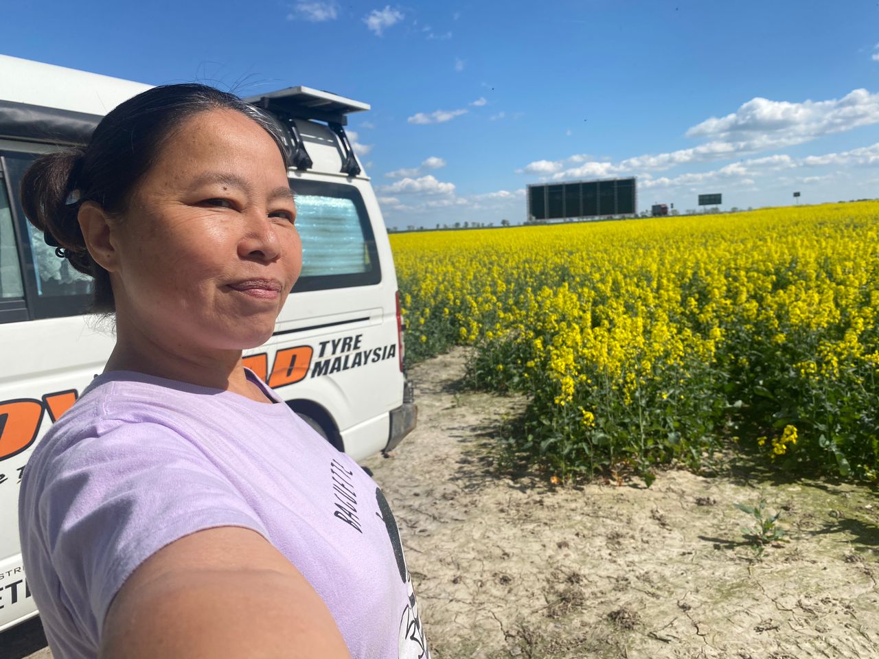 Tuzi with Toyotaki beside yellow fields in Poland